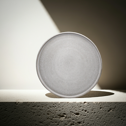 Large round gray stone goods plate from the ddoria collection. Made of durable material, suitable for dinner use.