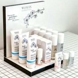This intimate care set includes a variety of products in white and blue packaging, featuring the "Woman Essentials" branding. The products appear to be skincare or personal care items, likely designed for women's daily care routine.