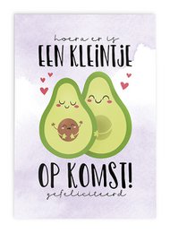 Greeting card featuring two avocados with a baby avocado inside, celebrating a new arrival. The text reads "Hooray, it's a little one on the way!" in Dutch.