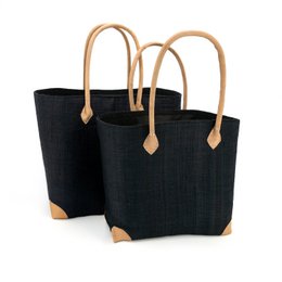  Black handcrafted woven basket with natural tan leather handles, rectangular shape, storage tote bag.