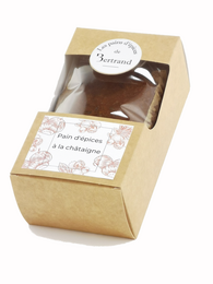 Chestnut-flavored gingerbread cookie in a gift box. The gingerbread has a warm, spicy aroma and a soft, moist texture. The cookie is packaged in a simple, elegant cardboard box.