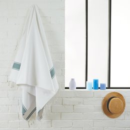 Soft, absorbent terry cloth beach and hammam towel in a variety of colors including blue, gray, orange, yellow, beige, and green.