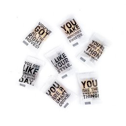Individually wrapped shortbread cookies with inspirational quotes, 85 pieces in a box. Cookies in a variety of shapes and sizes with text such as "You are the thing" and "Like your day".