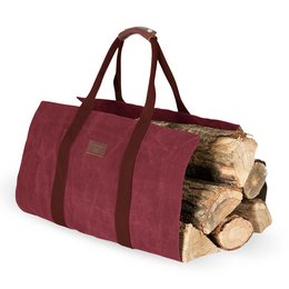 Burgundy canvas log bag with leather accents, designed for storing and transporting firewood. Features a sturdy construction and comfortable handles for easy carrying.