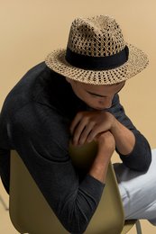 Straw crochet fedora hat in neutral tones, available in sizes S, M, L. Features a woven straw texture and classic fedora silhouette.