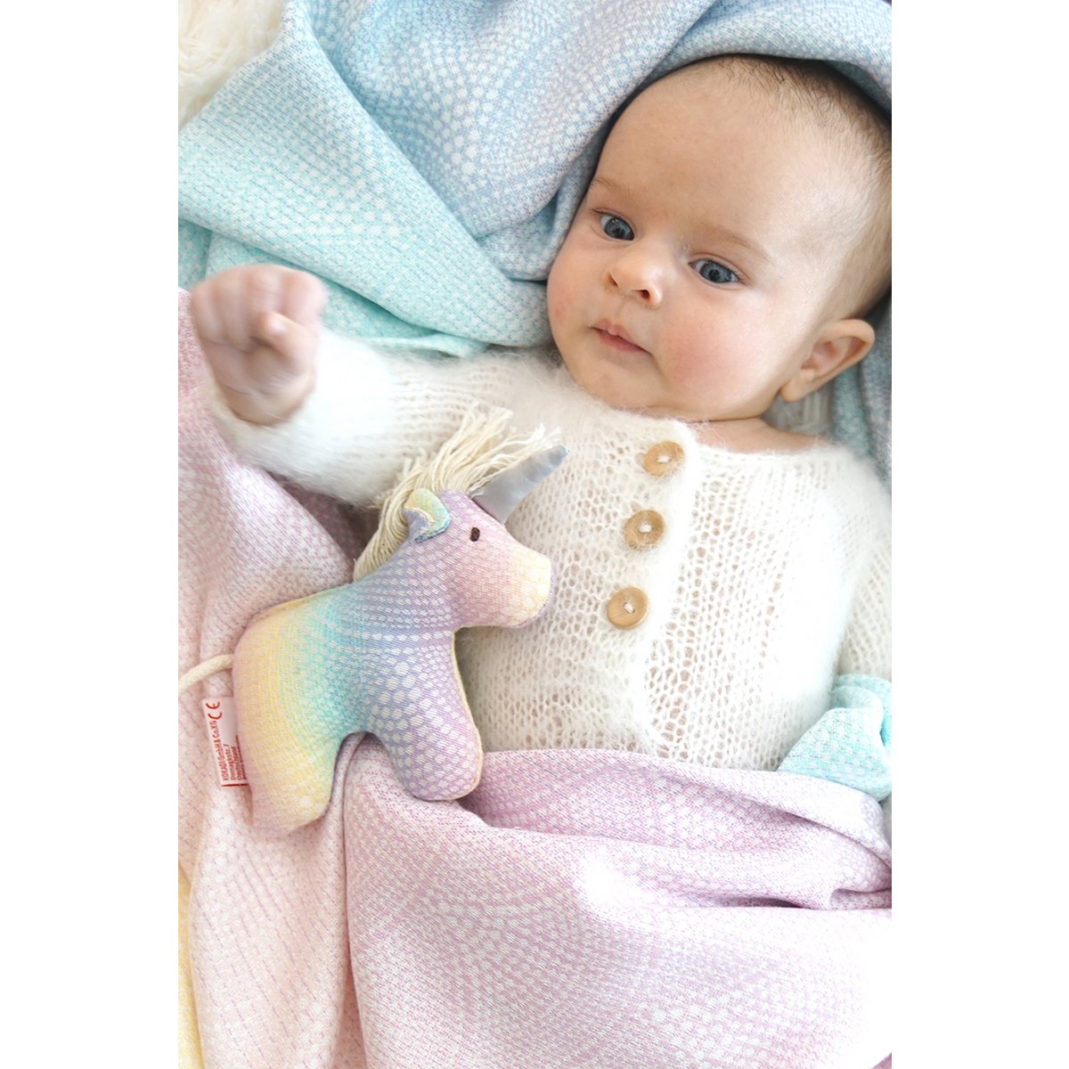 Clutching toy unicorn Arielle Marie