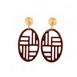 Oval-shaped burgundy earrings with a geometric pattern and gold accents.