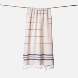 Cream beige striped hammam towel with navy blue stripes and fringe trim, lightweight cotton.