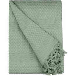 "Emerald green waffle-textured bedspread with tasseled edges, suitable for a cozy and stylish bedroom decor."
