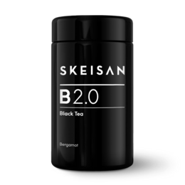 Black tea with bergamot flavor in a tall glass container.