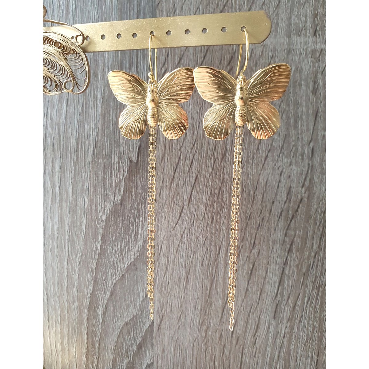 Long-length rhodium plated butterfly earrings