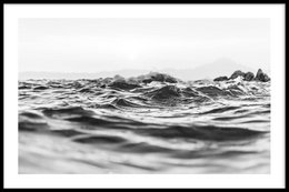 Poster featuring a black and white image of ocean waves, suitable for home or office decor. The poster has various size options and can be framed or printed on canvas.