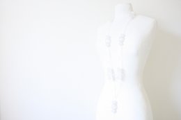 Long white necklace with charms