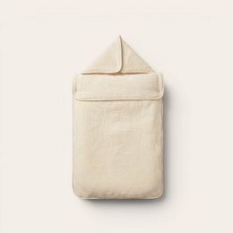  Cream-colored, soft, plush sleeping nest with quilted texture and cozy design for comfortable sleeping.