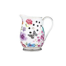 Large white ceramic jug with colorful floral and polka dot pattern.