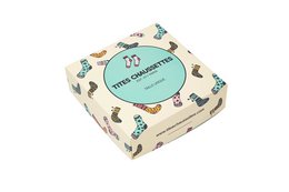 Square-shaped gift box with colorful animal print pattern, containing socks.