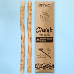 Two natural siwak (miswak) toothbrush sticks in a cardboard package labeled "Orfinko". The sticks are light brown in color and appear to be made of natural plant material.