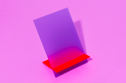 Lilac and fluo red desk organizer with a patterned surface, designed for office supplies.