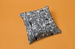 Square cushion cover in a geometric black and white pattern, designed and made in Barcelona.