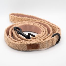 Beige fabric belt with adjustable length and metal buckle. Suitable for casual and formal wear.