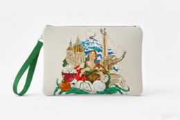  Beige clutch bag with colorful illustration of a woman surrounded by various animals and landmarks.