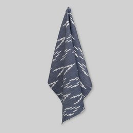 Navy blue tea towel with handwoven ikat v-pattern design.
