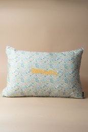 Light blue floral patterned cushion with yellow text, romantic style pillow, decorative home accent