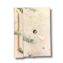 A handmade notebook with a nature-inspired cover featuring a pressed flower or leaf design. The notebook has a rustic, earthy aesthetic with a textured cover and exposed binding.