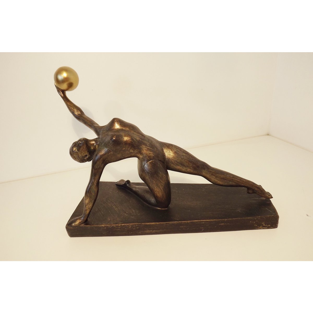 gymnast with gold ball