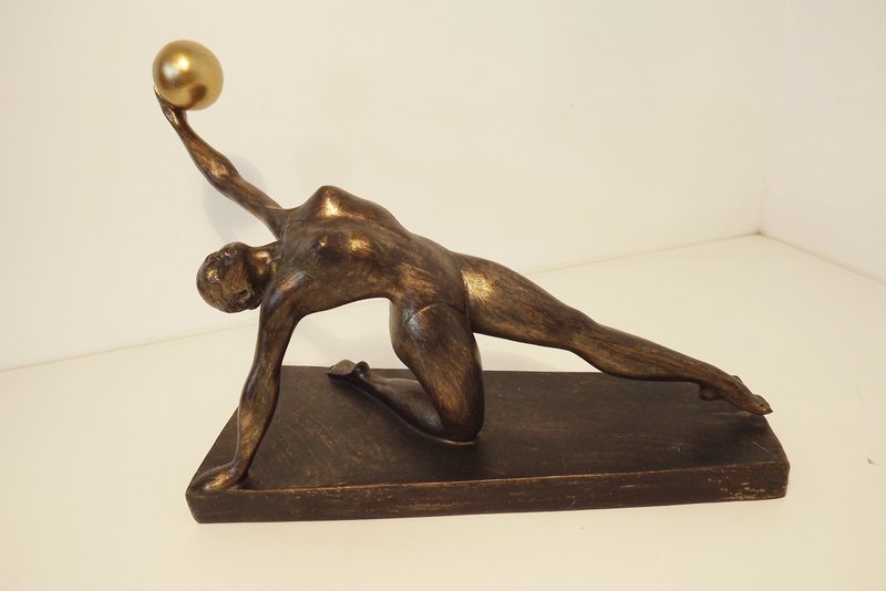 gymnast with gold ball