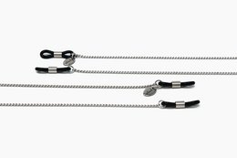 Thin silver glasses chain with adjustable length and clasp closure. Suitable for securing sunglasses or eyeglasses.