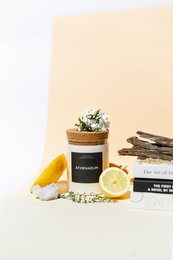 Handmade scented candle in brown or clear glass container, 220g, with floral and citrus notes.