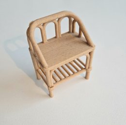Wooden dollhouse bedside table with arched backrest and slatted seat.