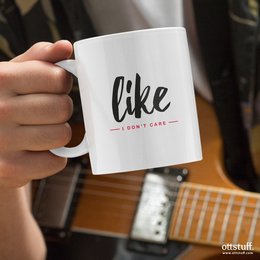 A white ceramic mug with the text "Like (I don't care)" printed on it. The mug has a simple, minimalist design with the word "Like" in a stylized font.
