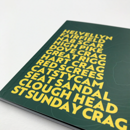 A green hardcover notebook with the title "Eastern Fells Journal" printed in bold yellow text. The cover features a typographic design with various words and phrases related to nature and outdoor exploration.
