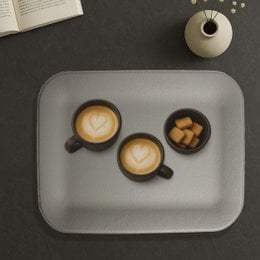 Small flat tray made of artificial brown leather with a stingray texture pattern.