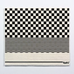 A black and white checkered cloth with a striped pattern at the bottom.
