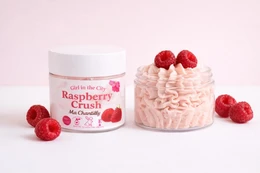  Raspberry Crush whipped body butter, natural shea, pink cream texture, fruity scent, moisturizing skincare product.