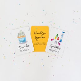 Colorful gift cards with playful designs, including a cupcake, confetti, and a movie clapper board. The cards feature whimsical text and illustrations, suggesting a fun, celebratory theme.