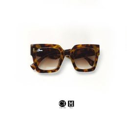 Stylish square-framed sunglasses in brown, white, and blue colors from the Monett Manifesto Safis collection.
