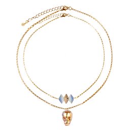 Layered skull necklace with astral orange pendant. Crafted with gold-tone chain and features a layered skull pendant with an astral orange stone accent.