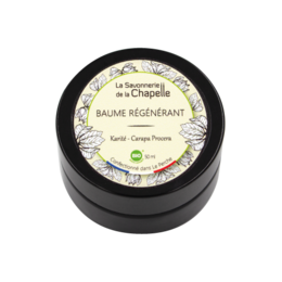 A moisturizing and regenerating shea butter cream in a round black container with a green and white label.