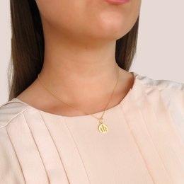 Gold-toned necklace with a circular pendant featuring a minimalist fork and knife icon, suitable for casual or formal wear.