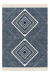 "A large, rectangular indoor/outdoor rug with a geometric diamond pattern in shades of blue and white. The rug appears to be made of durable, weather-resistant materials suitable for use both indoors and outdoors."