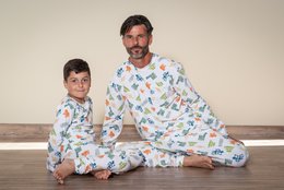 Colorful kids' pajamas with an Aztec-inspired print, featuring a variety of playful animal motifs. Available in multiple sizes.