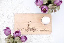  Wooden breakfast board with bicycle design, featuring walnuts and pine cones. Rustic, natural decor elements.