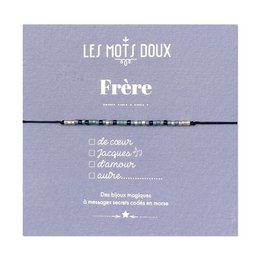  A navy blue and white bracelet with a Morse code design, representing the word "Frère" (brother in French). The bracelet is part of the "Les Mots Doux" collection.