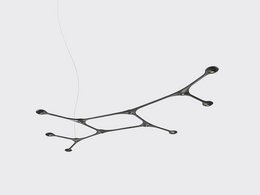 A modern, minimalist pendant light fixture with a branching, organic design in a dark carbon color.
