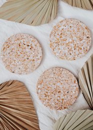  Round cork coasters with natural speckled texture, beige and tan colors, minimalist design, absorbent material.