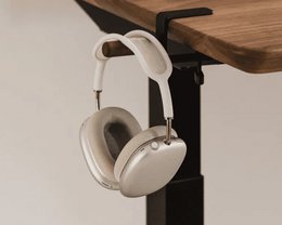 Desk-mounted headphone hook in walnut, oak, and black wood finishes. Minimalist clamp organizer for headsets.